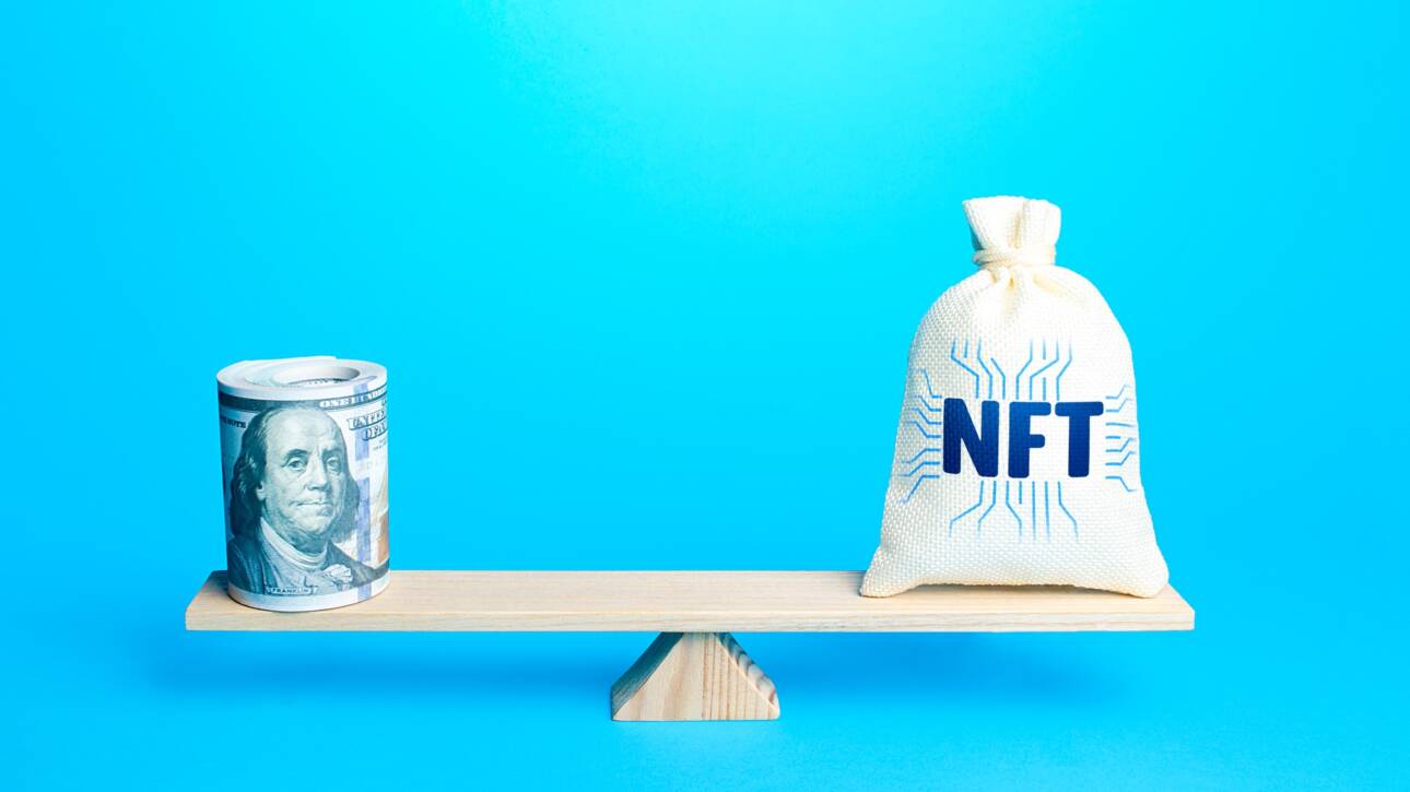Bag with NFT non-fungible token and a bundle of dollars on scales.